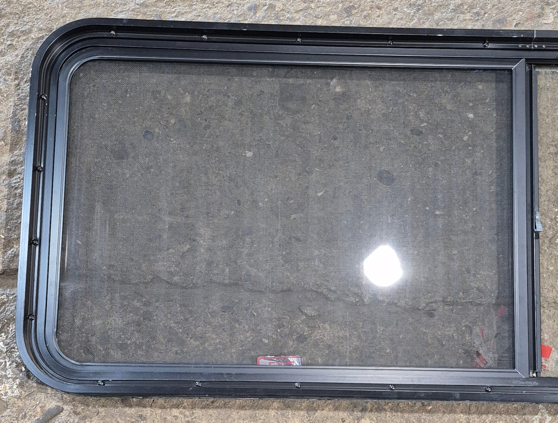Used Black Radius Opening Window : 60 1/4" W x 21 3/4" H x 1 3/4" - Young Farts RV Parts