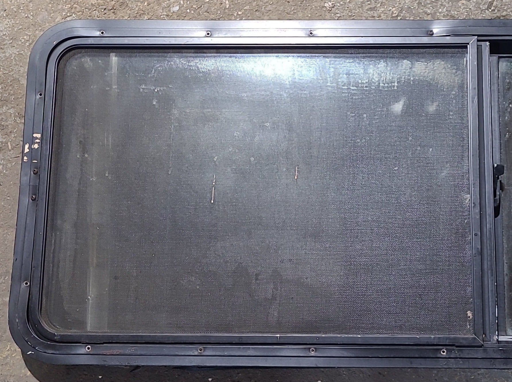 Used Black Radius Opening Window : 60" W x 21 1/2" H x 2" D - Young Farts RV Parts