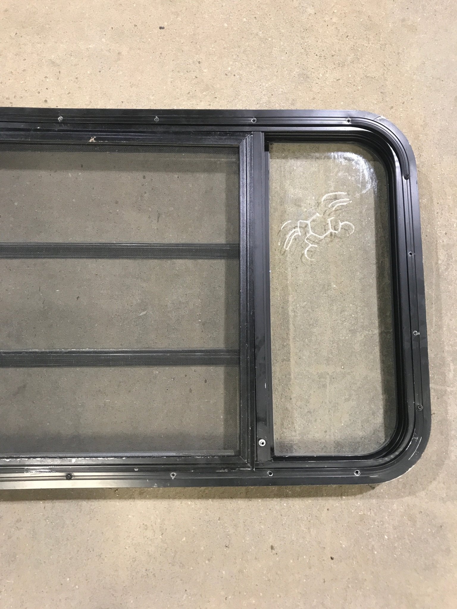 Used Black Radius Opening Window : 60" W x 21 3/4" H x 2" D - Young Farts RV Parts