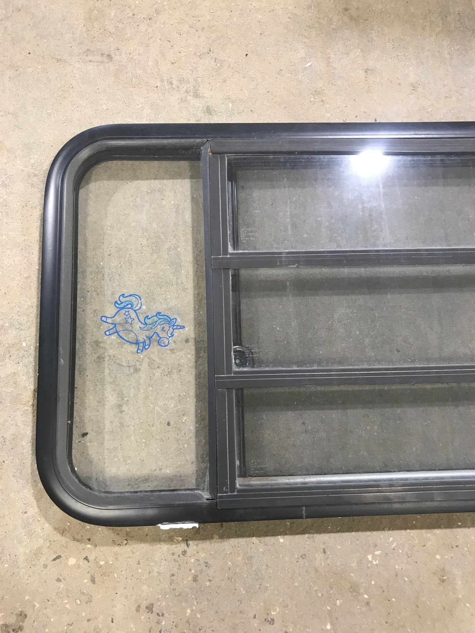 Used Black Radius Opening Window : 60" W x 21 3/4" H x 2" D - Young Farts RV Parts