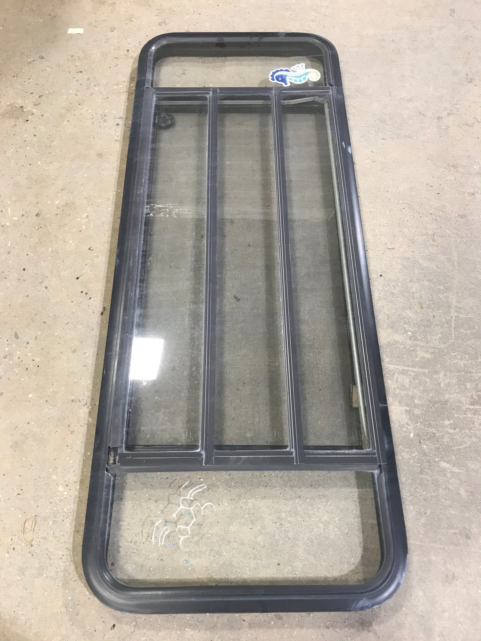 Used Black Radius Opening Window : 60" W x 21 3/4" H x 2" D - Young Farts RV Parts