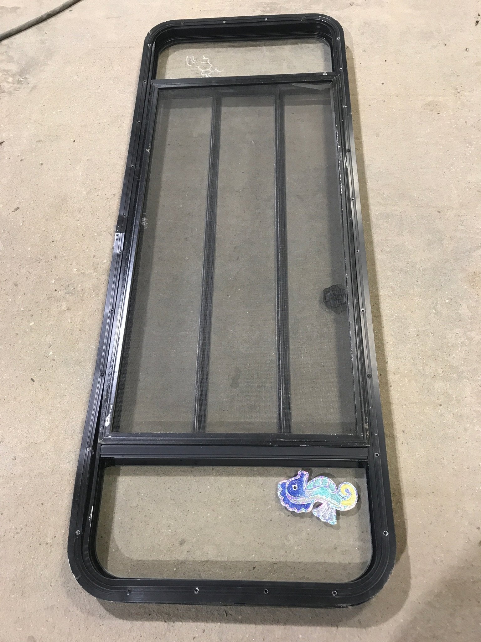Used Black Radius Opening Window : 60" W x 21 3/4" H x 2" D - Young Farts RV Parts