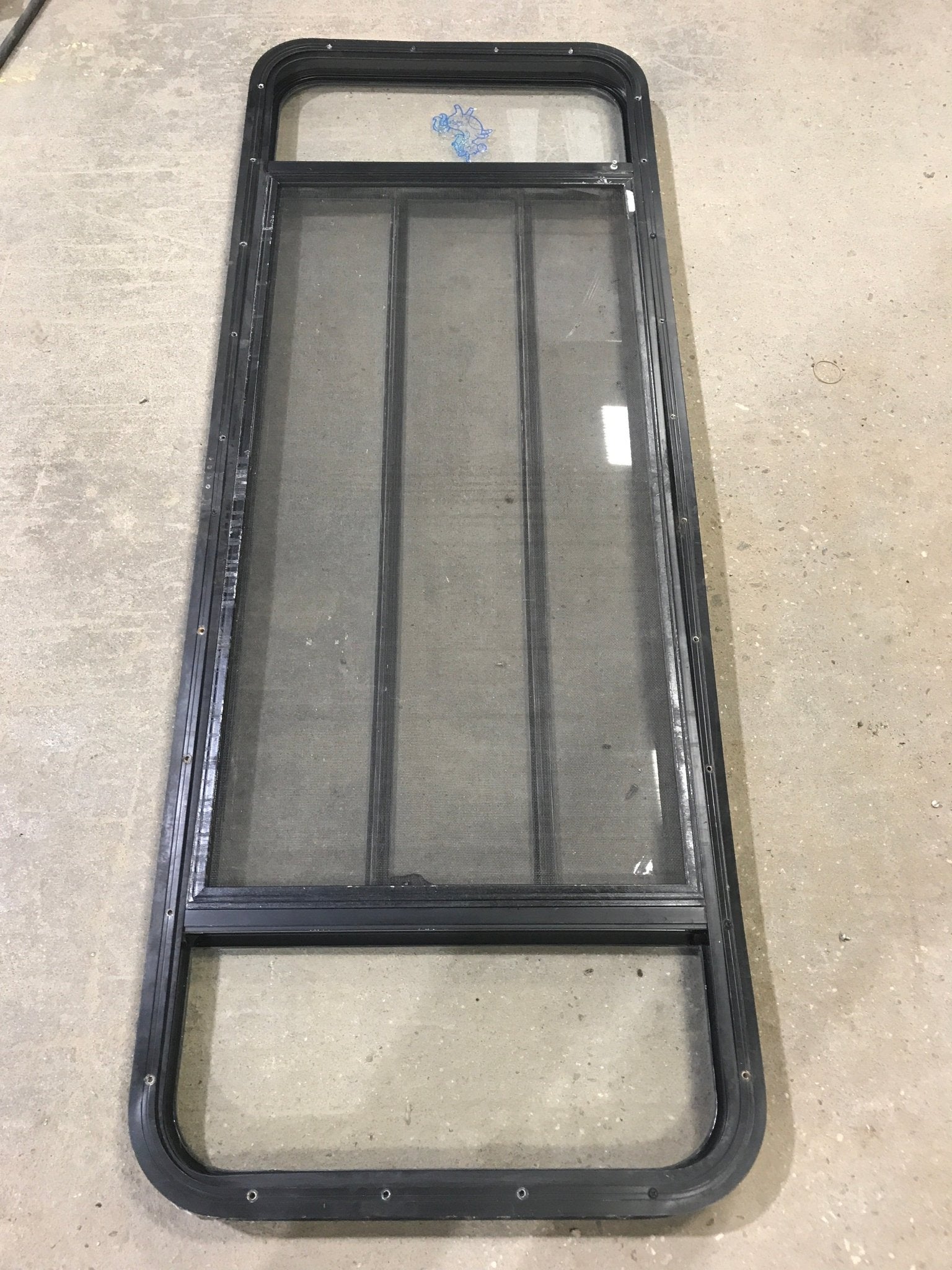 Used Black Radius Opening Window : 60" W x 21 3/4" H x 2" D - Young Farts RV Parts