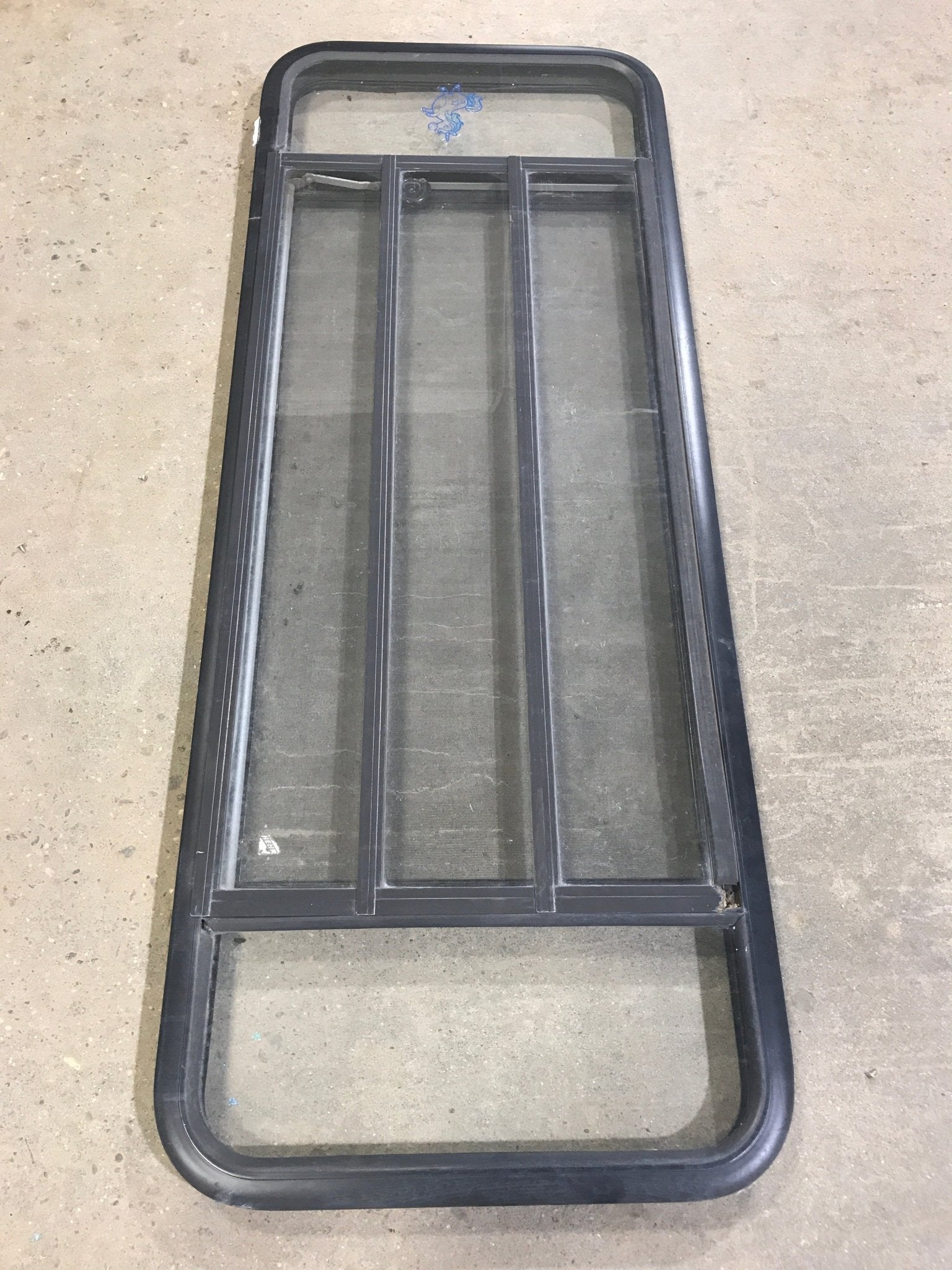 Used Black Radius Opening Window : 60" W x 21 3/4" H x 2" D - Young Farts RV Parts