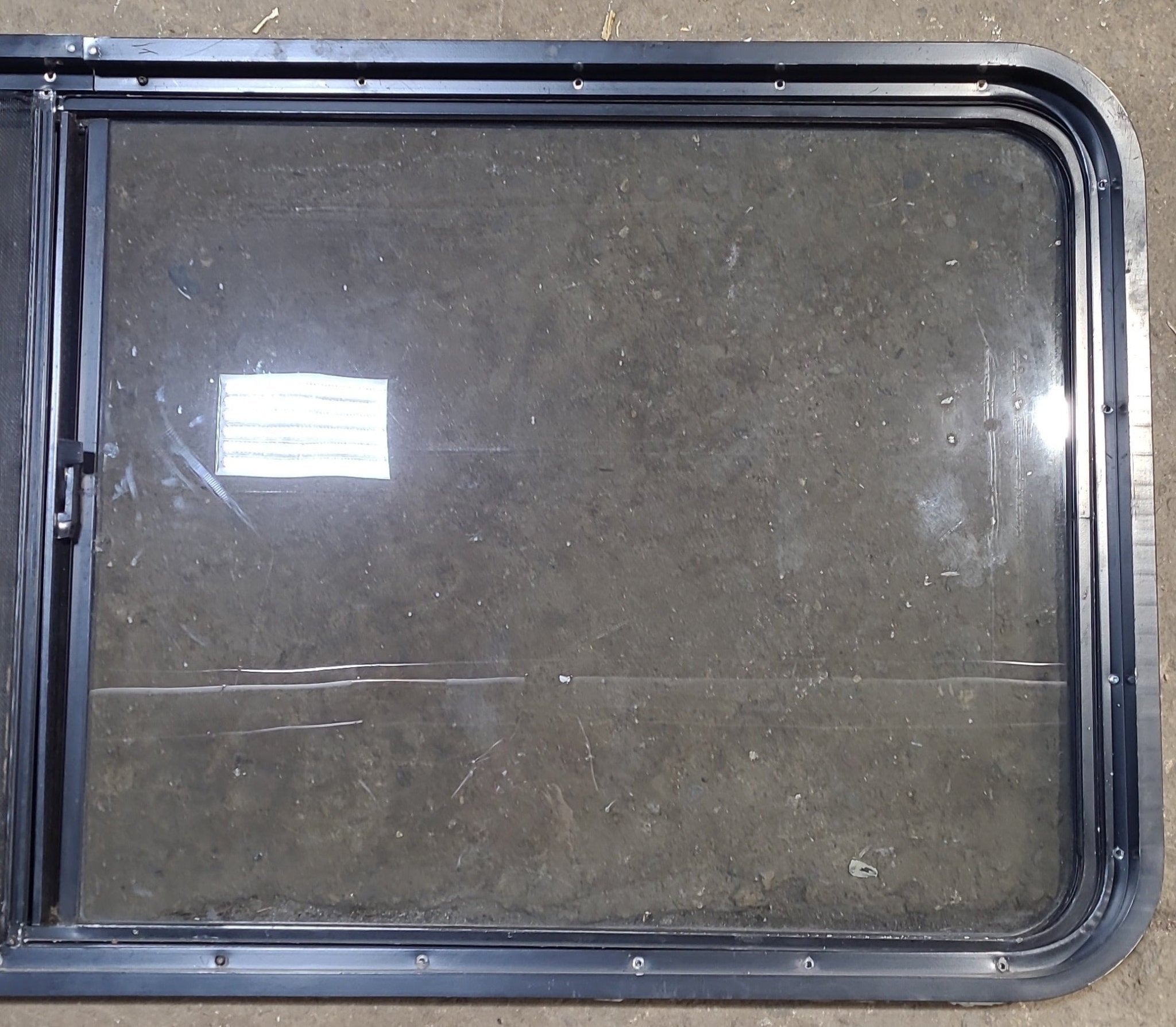 Used Black Radius Opening Window : 60" W x 25 3/4" H x 2" D - Young Farts RV Parts