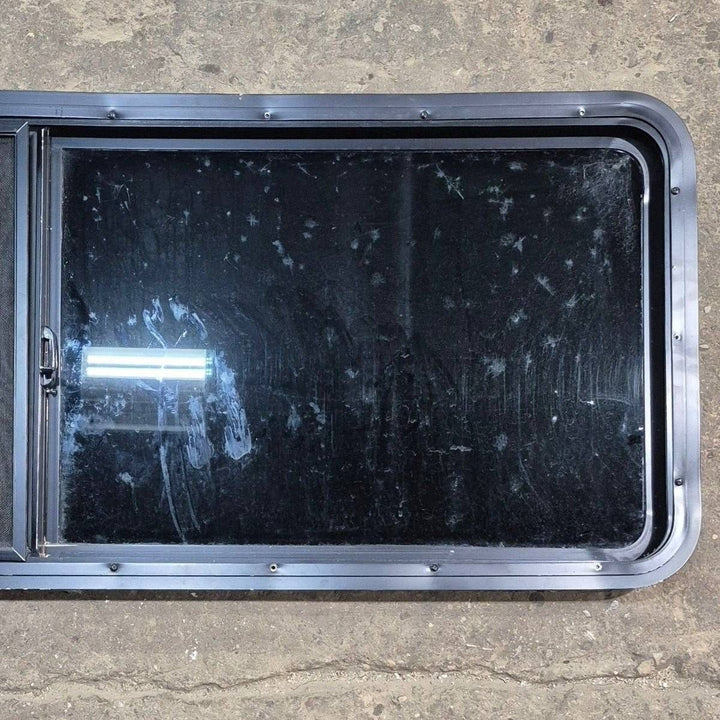 Used Black Radius Opening Window - 60" X 21 1/2" X 1 7/8" - Young Farts RV Parts