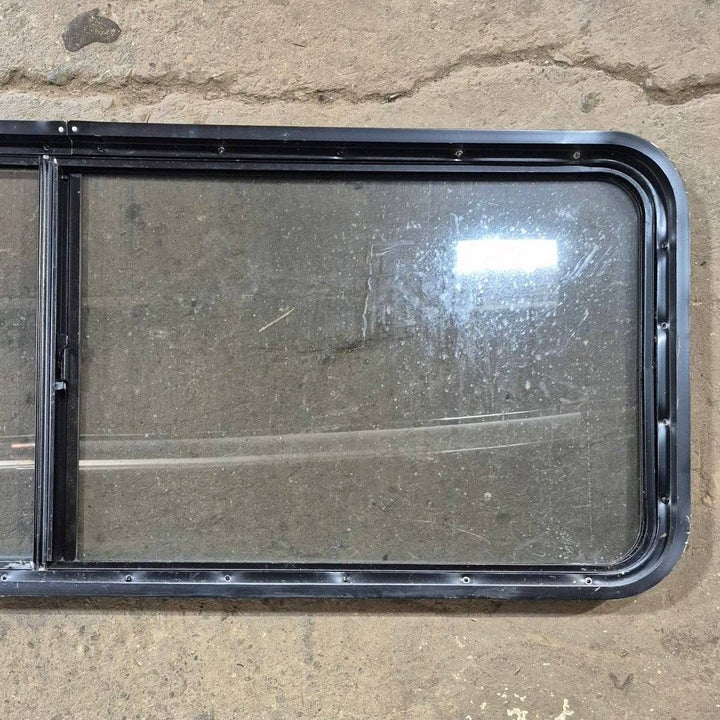 Used Black Radius Opening Window - 60 X 23 1/2 X 2 - Young Farts RV Parts