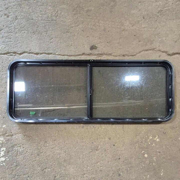 Used Black Radius Opening Window - 60 X 23 1/2 X 2 - Young Farts RV Parts