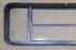 Used Black Radius Opening Window : 61 3/4" W x 19 1/2" H x 1 3/4" D - Young Farts RV Parts