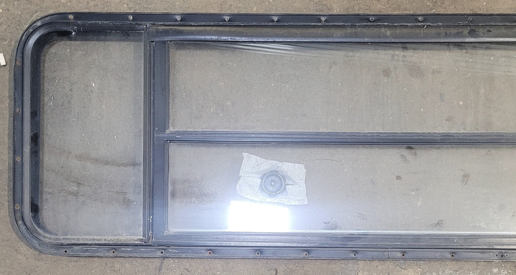 Used Black Radius Opening Window : 61 3/4" W x 19 1/2" H x 1 3/4" D - Young Farts RV Parts