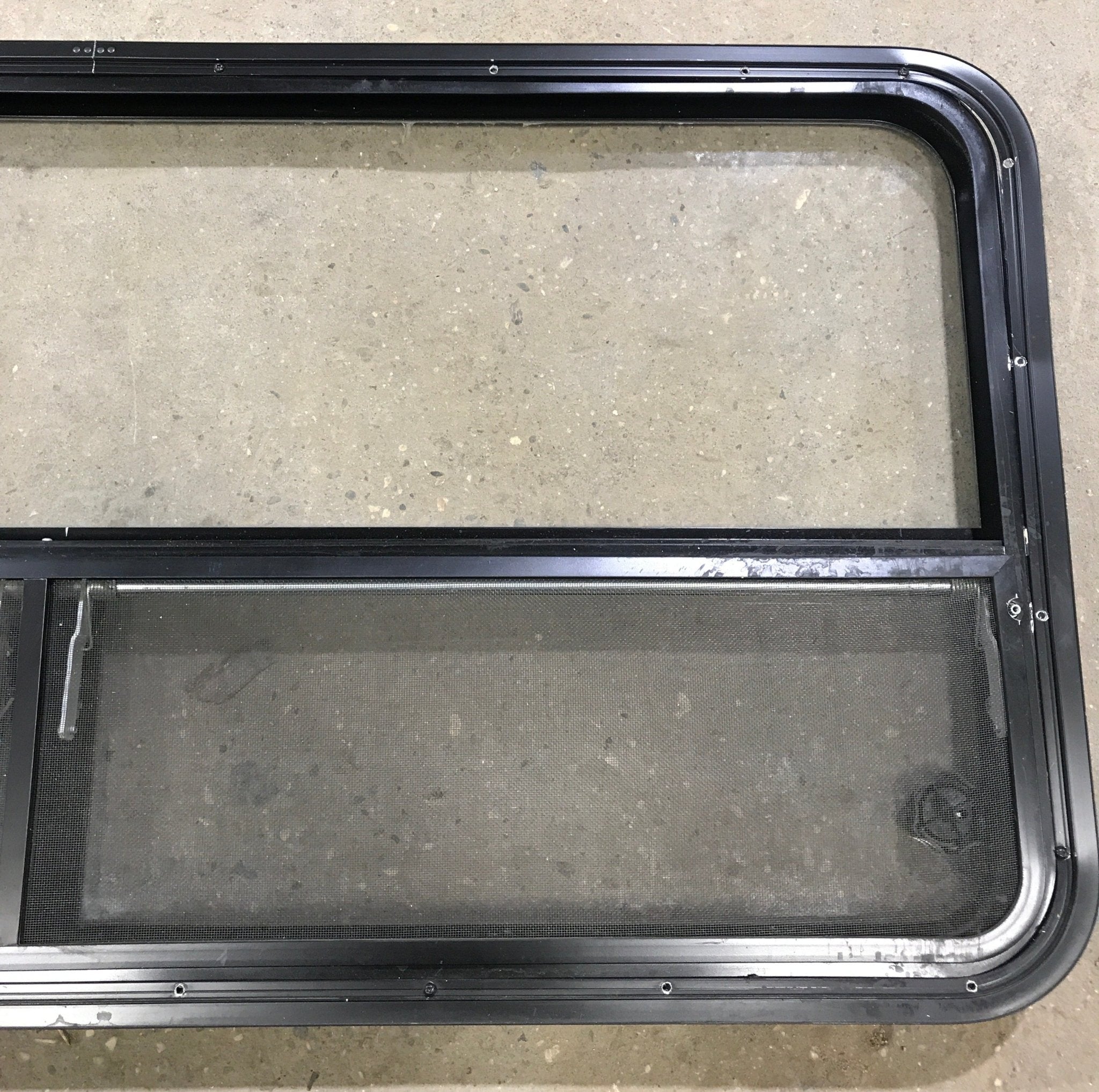 Used Black Radius Window : 53 1/4" W x 25 1/4" H x 2 1/4" D - Young Farts RV Parts