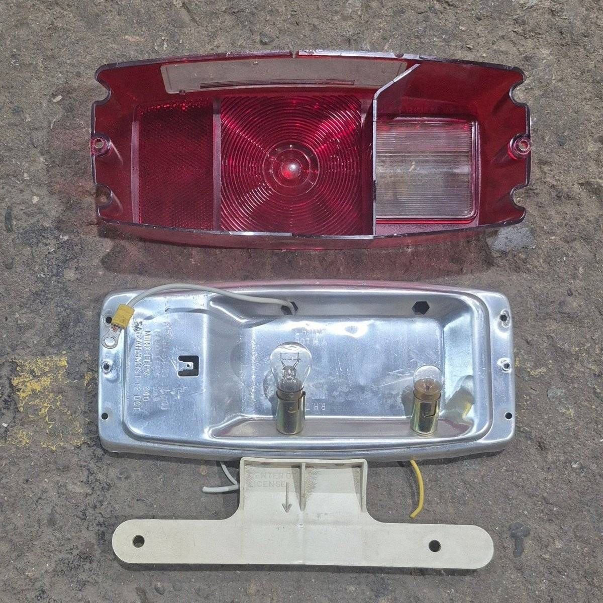Used Miro-Flex RV Tail Light Assembly, With License Plate Bracket, 10 1/8" X 7" X 2 3/4" - 340 - Young Farts RV Parts