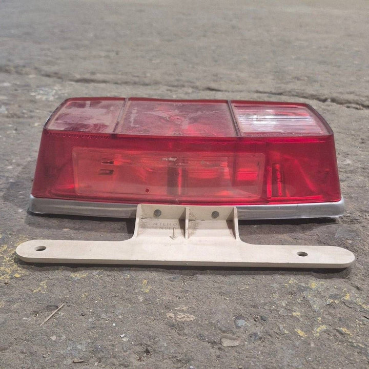 Used Miro-Flex RV Tail Light Assembly, With License Plate Bracket, 10 1/8" X 7" X 2 3/4" - 340 - Young Farts RV Parts