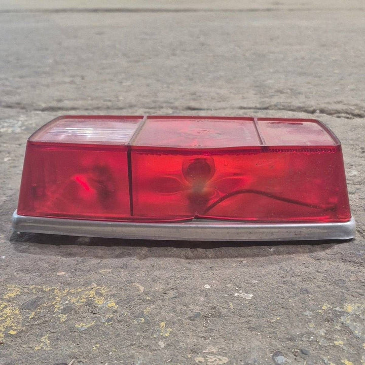 Used Miro-Flex RV Tail Light Assembly, With License Plate Bracket, 10 1/8" X 7" X 2 3/4" - 340 - Young Farts RV Parts