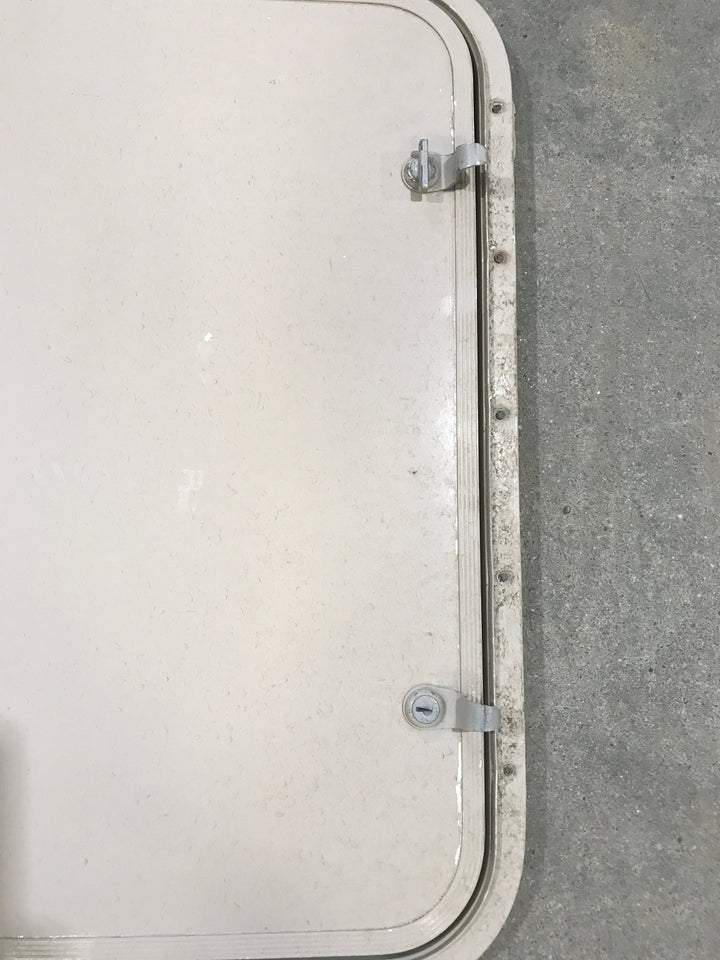 Used Radius Corner cargo door 23 3/4" W x 21 3/4" H x 1/2" D - Young Farts RV Parts