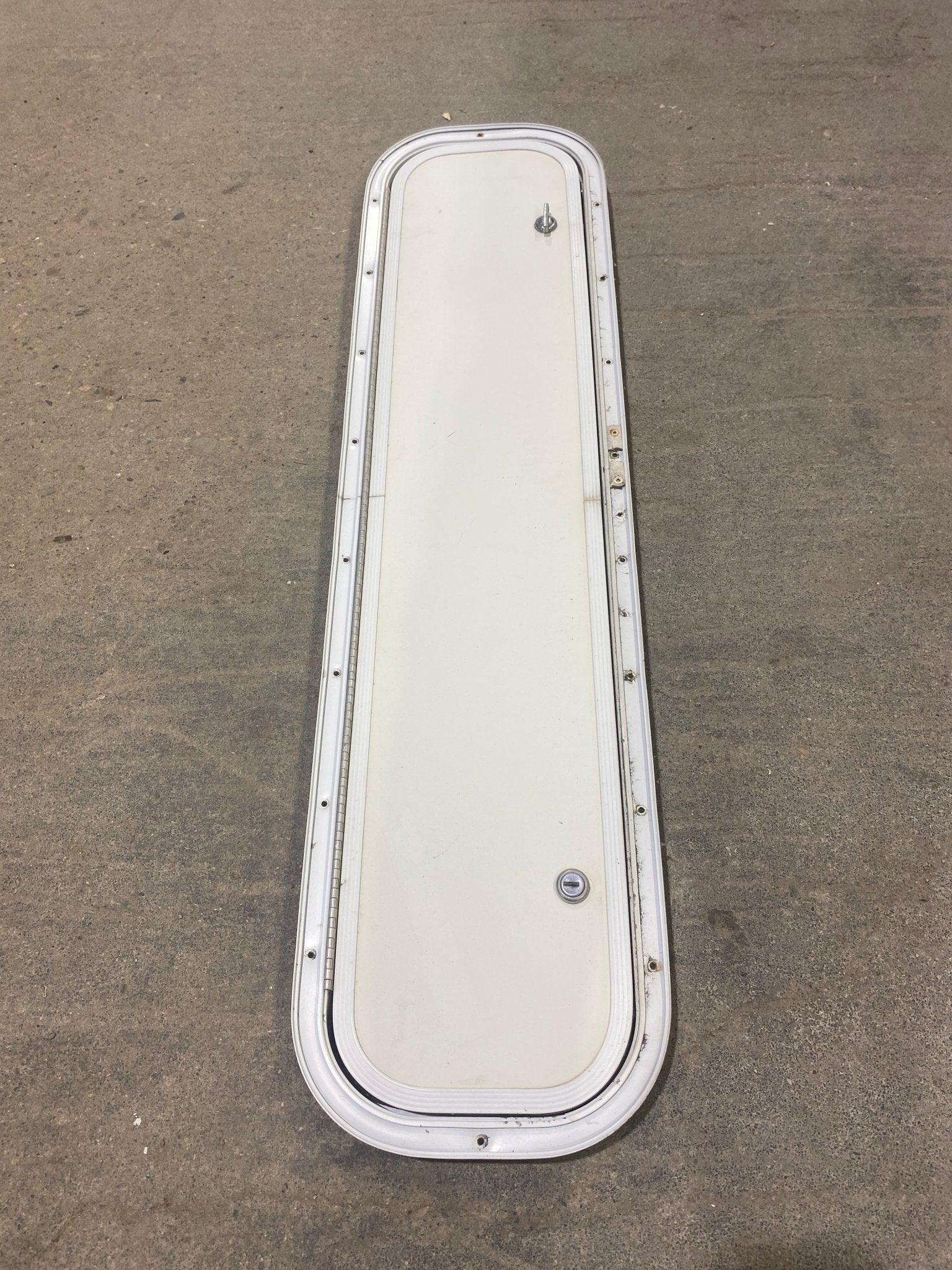 Used Radius Corner Cargo Door 35 1/2" W x 7 3/4" H x 3/4" D - Young Farts RV Parts