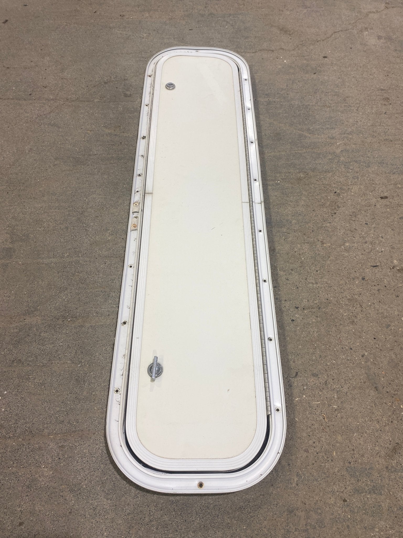 Used Radius Corner Cargo Door 35 1/2" W x 7 3/4" H x 3/4" D - Young Farts RV Parts
