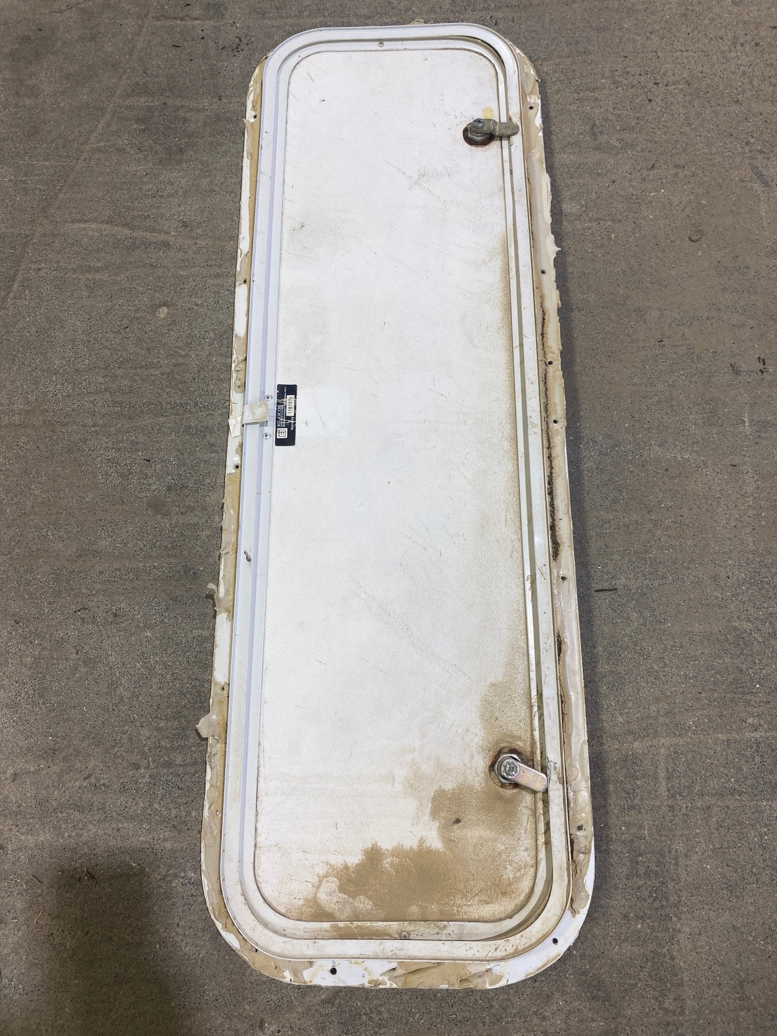 Used Radius Cornered Cargo Door 35 3/4" W x 10 3/4" H x 3/4" D - Young Farts RV Parts