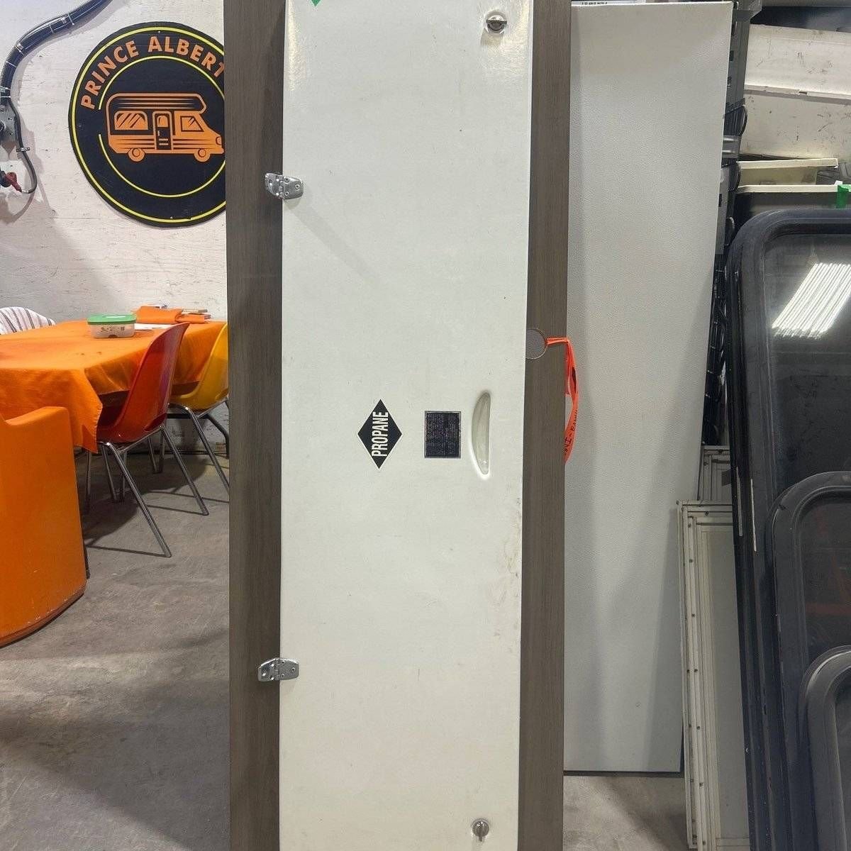 Used Radius Cornered Propane Cargo Door - 63.25 X 16.75 X .75 - Young Farts RV Parts