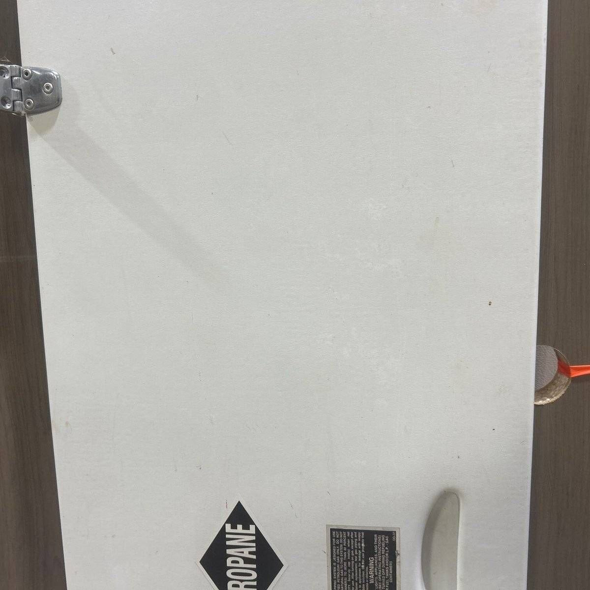 Used Radius Cornered Propane Cargo Door - 63.25 X 16.75 X .75 - Young Farts RV Parts