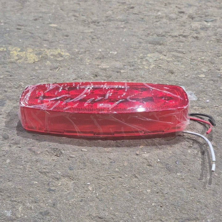 Used RV Tail Light Assembly, With License Plate Bracket, 8.625" x 4.125" x 1.25"- DOT SAE A2I6S2T2L 18 - Young Farts RV Parts