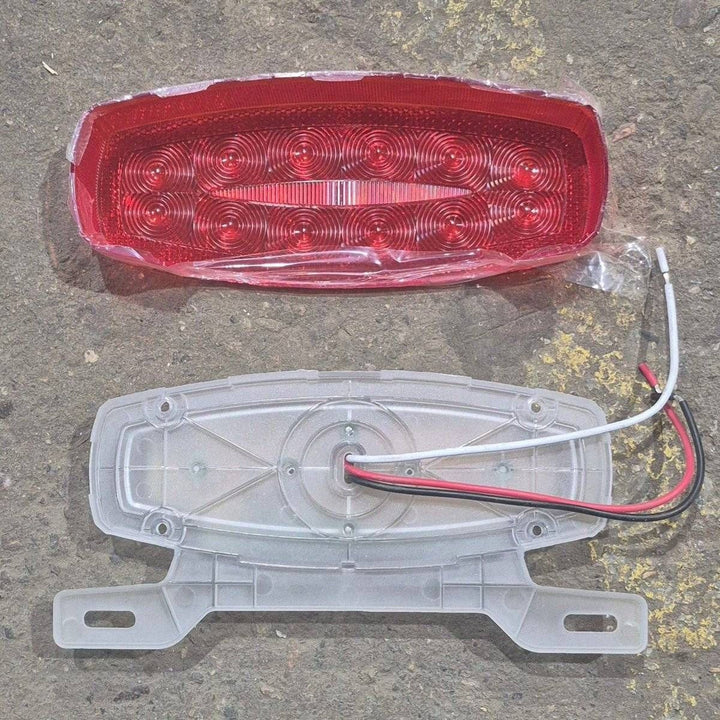 Used RV Tail Light Assembly, With License Plate Bracket, 8.625" x 4.125" x 1.25"- DOT SAE A2I6S2T2L 18 - Young Farts RV Parts