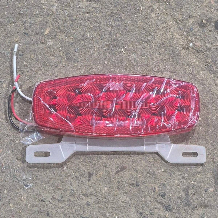 Used RV Tail Light Assembly, With License Plate Bracket, 8.625" x 4.125" x 1.25"- DOT SAE A2I6S2T2L 18 - Young Farts RV Parts