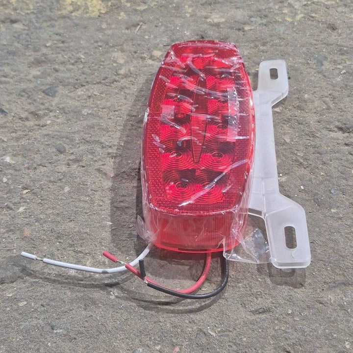 Used RV Tail Light Assembly, With License Plate Bracket, 8.625" x 4.125" x 1.25"- DOT SAE A2I6S2T2L 18 - Young Farts RV Parts