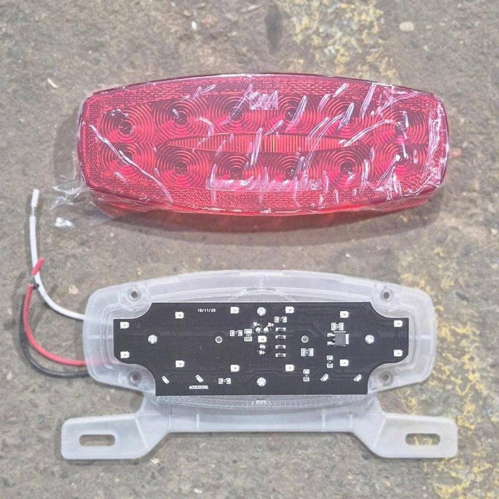 Used RV Tail Light Assembly, With License Plate Bracket, 8.625" x 4.125" x 1.25"- DOT SAE A2I6S2T2L 18 - Young Farts RV Parts