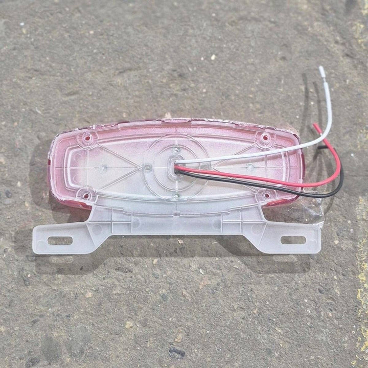 Used RV Tail Light Assembly, With License Plate Bracket, 8.625" x 4.125" x 1.25"- DOT SAE A2I6S2T2L 18 - Young Farts RV Parts