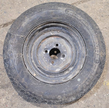 Load image into Gallery viewer, Used RV Tire &amp; Rim 12&quot; 4 bolt - Young Farts RV Parts