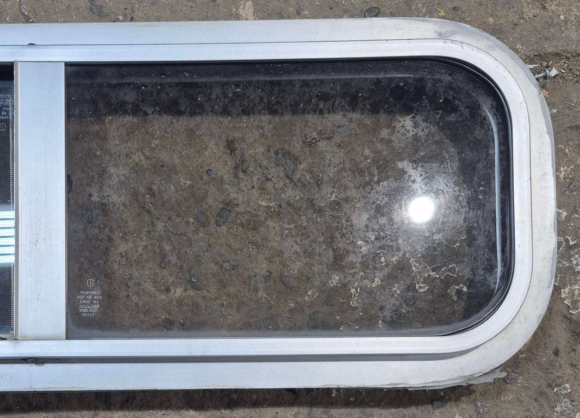 Used Silver Radius Opening Window : 26 1/2" W x 8 1/2" H x 1 3/4" D - Young Farts RV Parts