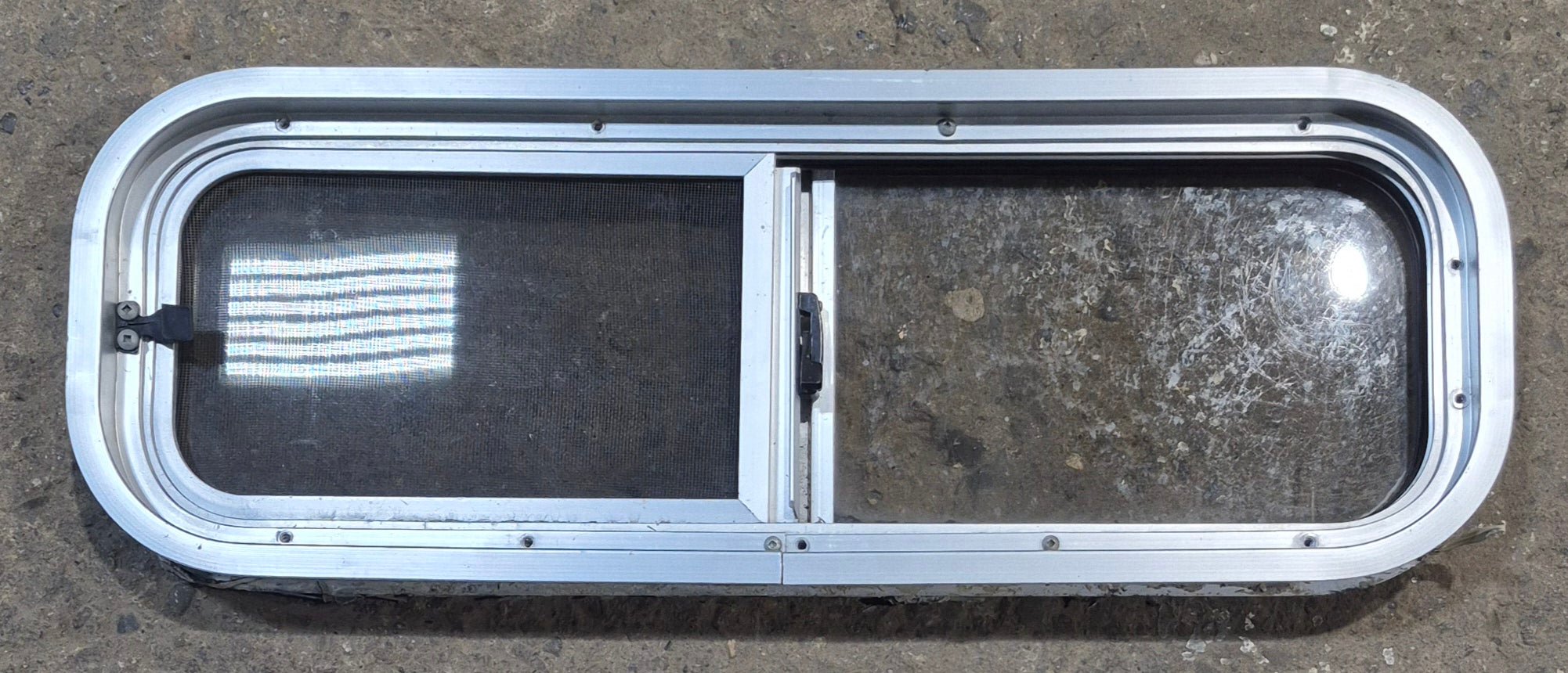Used Silver Radius Opening Window : 26 1/2" W x 8 1/2" H x 1 3/4" D - Young Farts RV Parts
