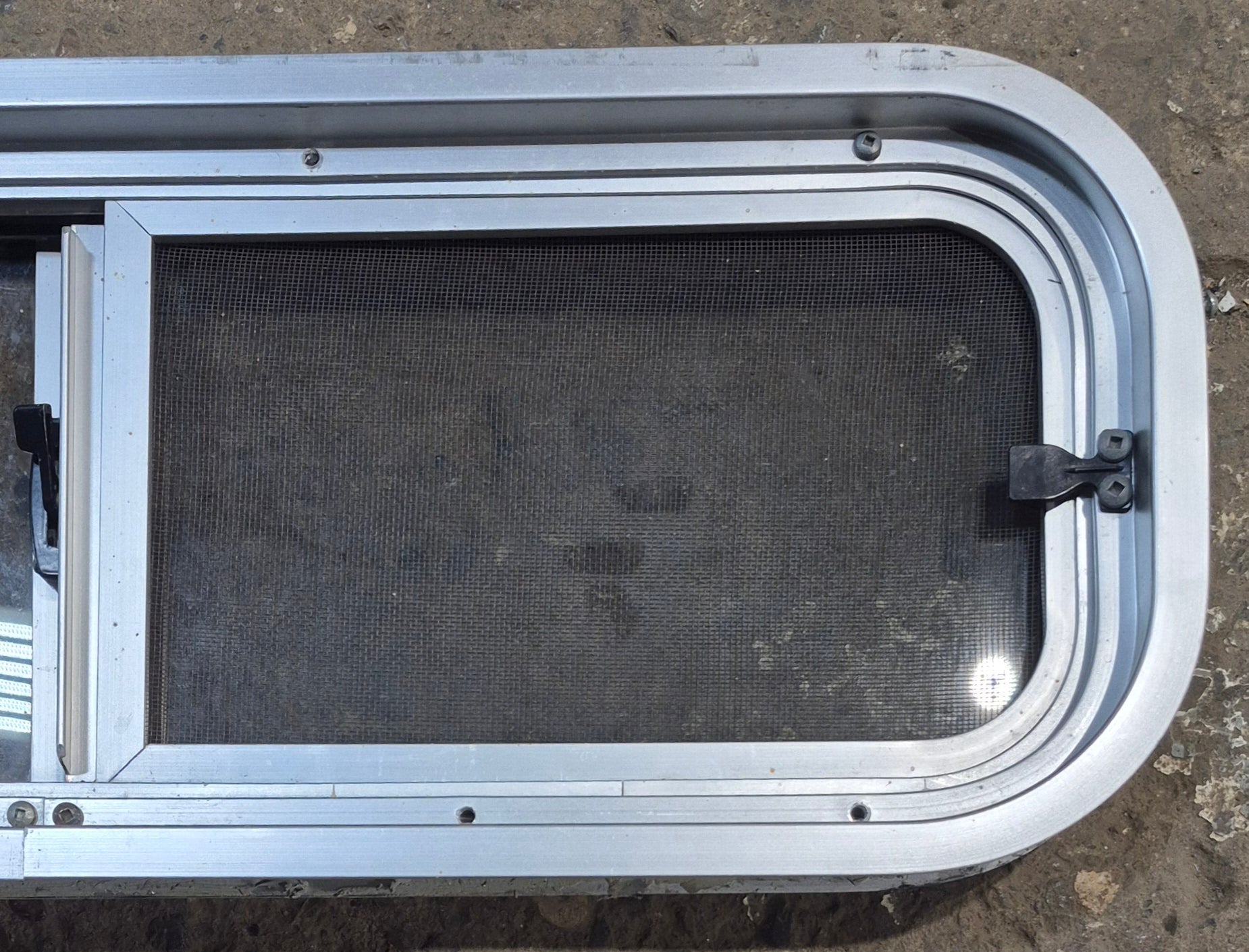 Used Silver Radius Opening Window : 26 1/2" W x 8 1/2" H x 1 3/4" D - Young Farts RV Parts