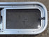 Used Silver Radius Opening Window : 26 1/2" W x 8 1/2" H x 1 3/4" D - Young Farts RV Parts