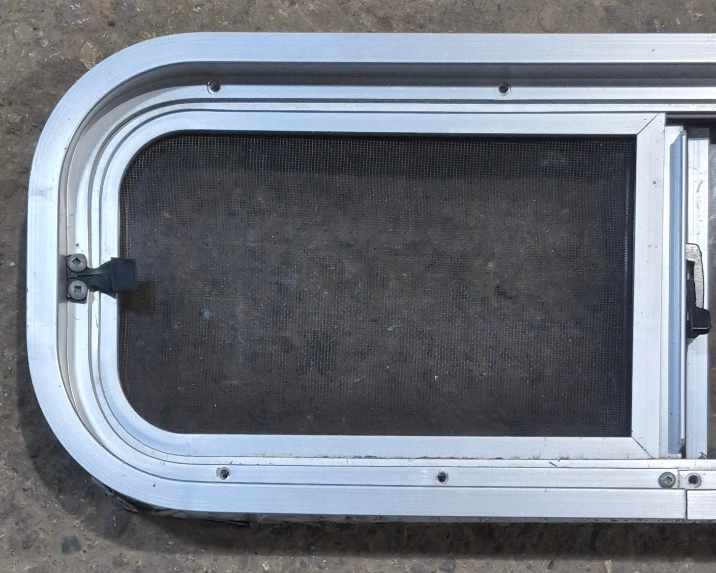 Used Silver Radius Opening Window : 26 1/2" W x 8 1/2" H x 1 3/4" D - Young Farts RV Parts