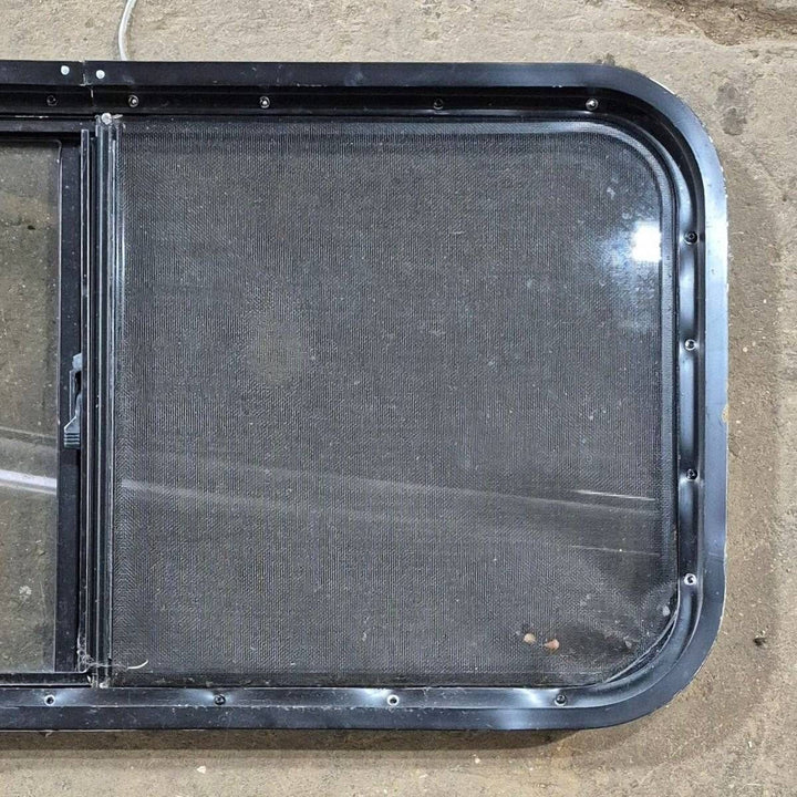 Used Slanted Black Radius Opening Window - 41 1/4" X 17 3/4" X 2" - Young Farts RV Parts