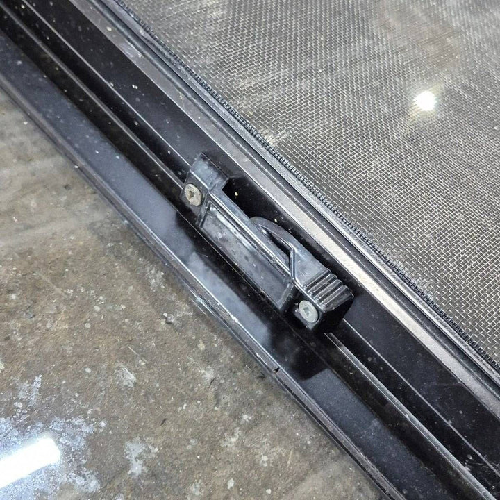 Used Slanted Black Radius Opening Window - 41 1/4" X 17 3/4" X 2" - Young Farts RV Parts
