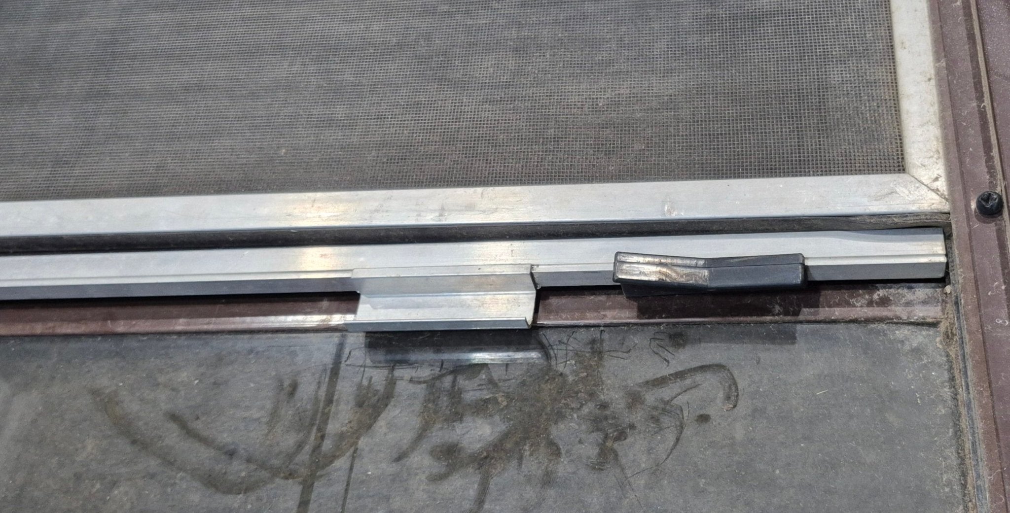 Used Slanted Brown Radius Opening Window : 55 1/2" W x 19 3/4" H x 1 1/4" D - Young Farts RV Parts