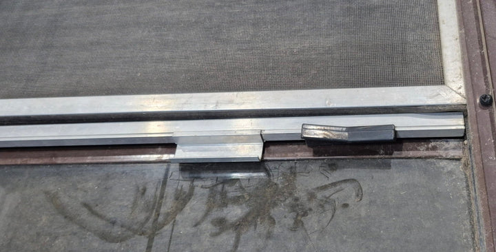 Used Slanted Brown Radius Opening Window : 55 1/2" W x 19 3/4" H x 1 1/4" D - Young Farts RV Parts