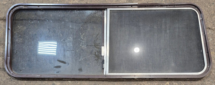 Used Slanted Brown Radius Opening Window : 55 1/2" W x 19 3/4" H x 1 1/4" D - Young Farts RV Parts