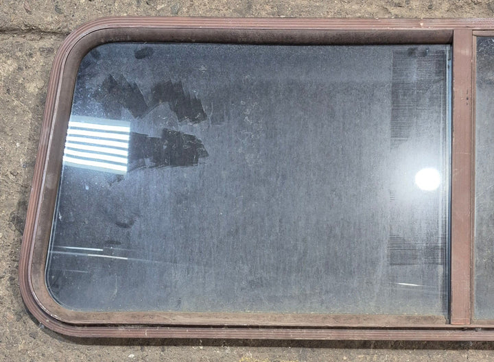 Used Slanted Brown Radius Opening Window : 55 1/2" W x 19 3/4" H x 1 1/4" D - Young Farts RV Parts