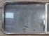 Used Slanted Brown Radius Opening Window : 55 1/2" W x 19 3/4" H x 1 1/4" D - Young Farts RV Parts