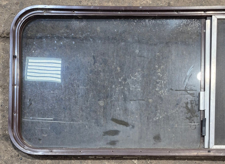 Used Slanted Brown Radius Opening Window : 55 1/2" W x 19 3/4" H x 1 1/4" D - Young Farts RV Parts