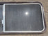 Used Slanted Brown Radius Opening Window : 55 1/2" W x 19 3/4" H x 1 1/4" D - Young Farts RV Parts