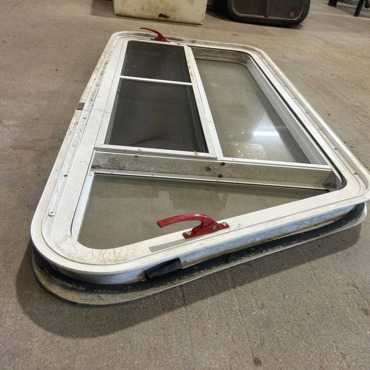 Used Slanted White Radius Emergency Opening Window - 49.25" x 23.25" x 1.875" - Young Farts RV Parts