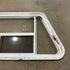 Used Slanted White Radius Emergency Opening Window - 49.25" x 23.25" x 1.875" - Young Farts RV Parts