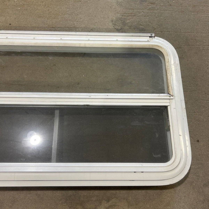 Used Slanted White Radius Emergency Opening Window - 49.25" x 23.25" x 1.875" - Young Farts RV Parts