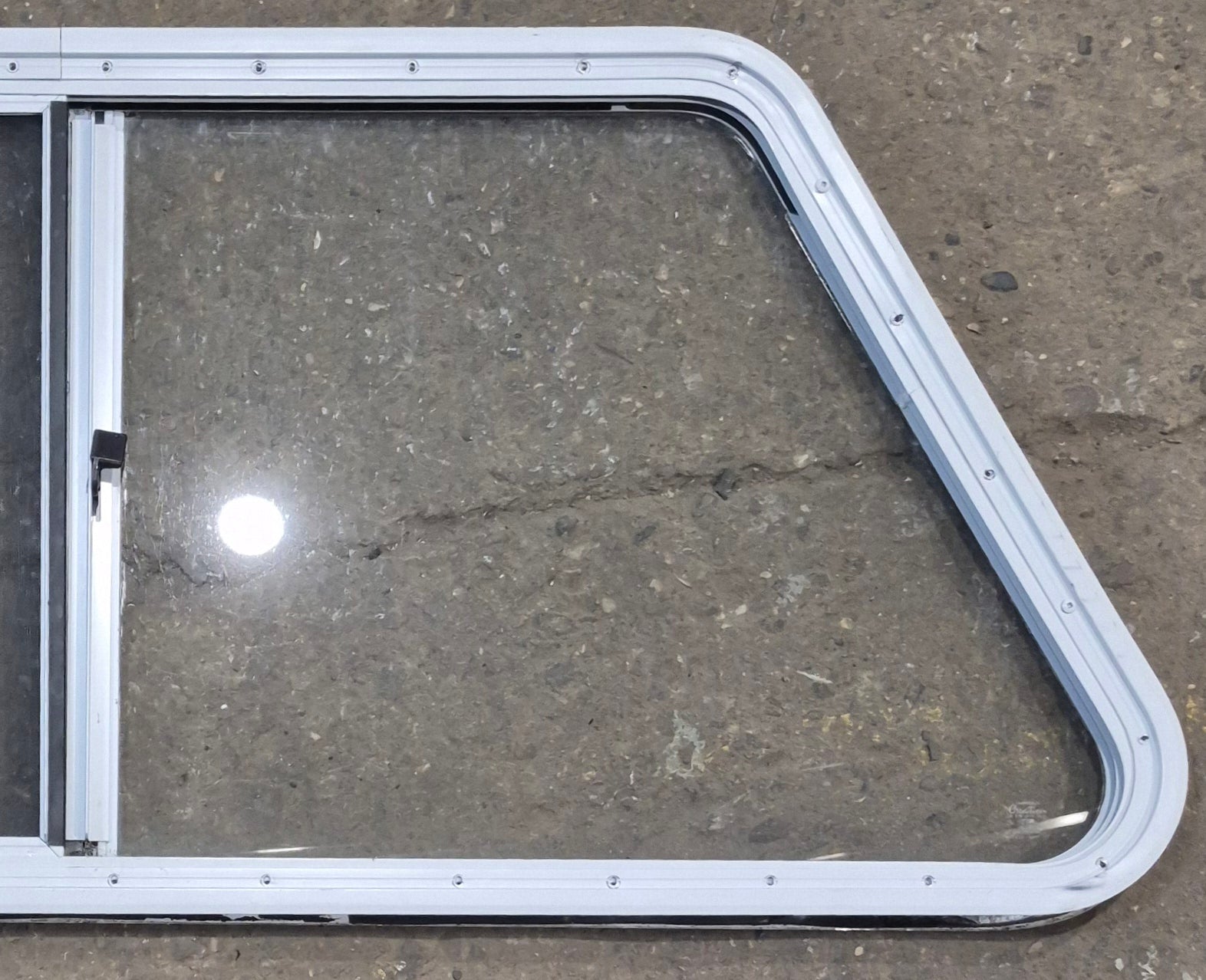 Used Slanted White Radius Opening Window : 46 3/4" W x 21 1/4" H x 1 1/4" D - Young Farts RV Parts