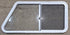 Used Slanted White Radius Opening Window : 46 3/4" W x 21 1/4" H x 1 1/4" D - Young Farts RV Parts